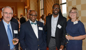 Pictured (LtoR) John O'Hara, Cristo Rey Jesuit High School tutor; Greg Sucre, Cristo Rey Jesuit High School Dean of Teaching & Learning; Walter Reap, Cristo Rey Jesuit High School principal; and Carol Baumerich, US Occupational Safety & Health Review Commission administrative law judge